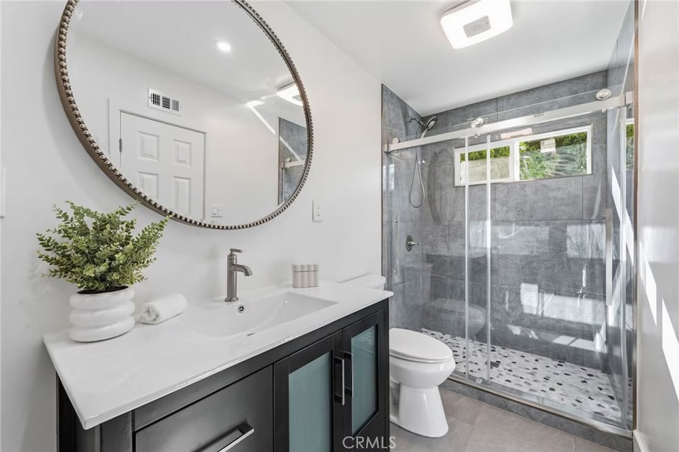 Primary bathroom with fully tiled shower